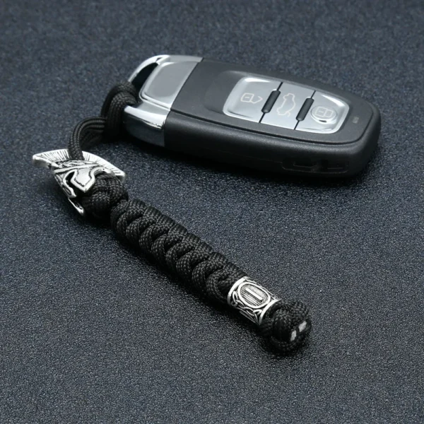 H143646b0a4e445e6aab1f31422bbfb6fp Dragonne de couteau en paracorde noire avec perle gravée de runes