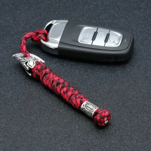 Dragonne de couteau en paracorde camouflage rouge avec perle gravée de runes