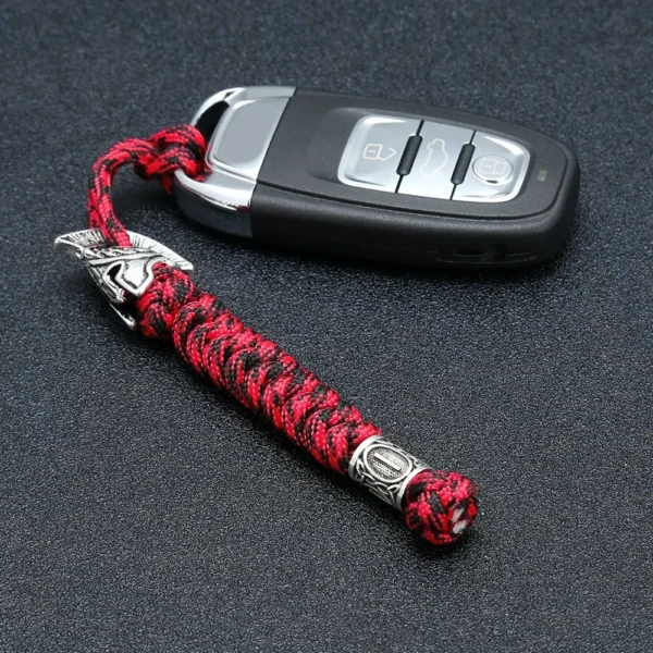 H8349b1946c3c41fc8d6057c424e892b9e Dragonne de couteau en paracorde camouflage rouge avec perle gravée de runes